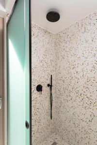 a room with a wall covered in flowers at Villa Sevos in Loutra