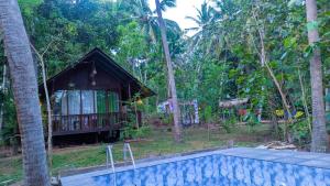 Bazén v ubytování Coconut Tree House nebo v jeho okolí