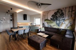 a living room with a couch and a table at Wiking in Kretowiny