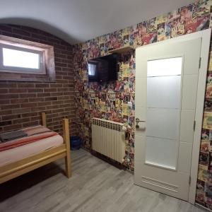 Televízia a/alebo spoločenská miestnosť v ubytovaní Palmers Lodge Hostel