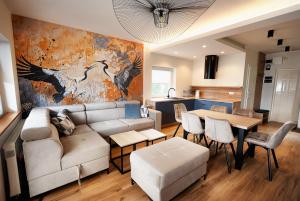 a living room with a couch and a table at Wiking in Kretowiny