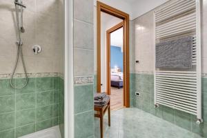 a bathroom with a shower and a bath tub at Casa Donati Zago in Tremosine Sul Garda +16 photos