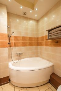 ห้องน้ำของ Cozy apartment in Riga in Torņkalns +14 ภาพ