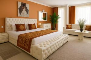 A bed or beds in a room at Парк Апарт-Хотел Виктория 1