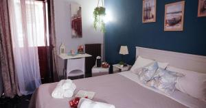 Postel nebo postele na pokoji v ubytování Al Bastione B&B