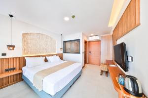 TV a/nebo společenská místnost v ubytování Lyxos Hotel