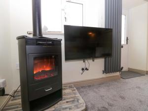 TV a/nebo společenská místnost v ubytování Yeat Stoup Cottage