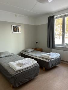 Postel nebo postele na pokoji v ubytování STF Sigtuna Vandrarhem