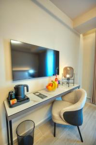TV a/nebo společenská místnost v ubytování ASTE hotel