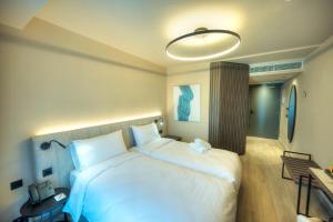 Postel nebo postele na pokoji v ubytování ASTE hotel