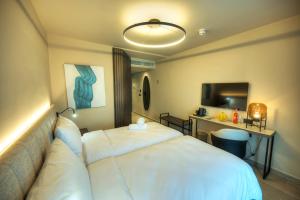 Postel nebo postele na pokoji v ubytování ASTE hotel