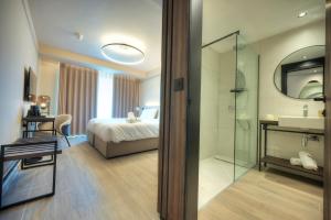 Postel nebo postele na pokoji v ubytování ASTE hotel