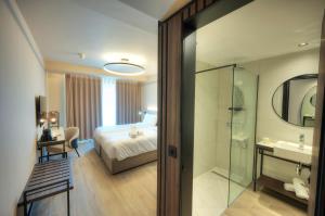 Postel nebo postele na pokoji v ubytování ASTE hotel