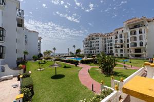 a view of the courtyard of a apartment building at 327 marina duquesa in Manilva