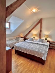 Postel nebo postele na pokoji v ubytování Apartmány Bašta & Wellness