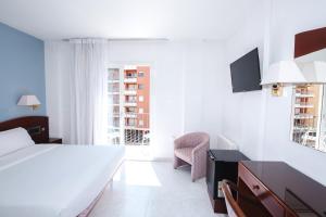 Postel nebo postele na pokoji v ubytování Hotel Plaça