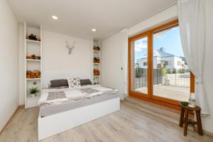 Postel nebo postele na pokoji v ubytování Apartmán Jezerní