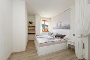 Postel nebo postele na pokoji v ubytování Apartmán Jezerní