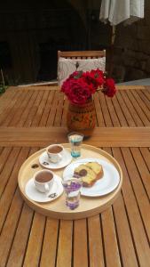a tray with two plates of food and coffee on a table at Has Cave Konak in Ürgüp