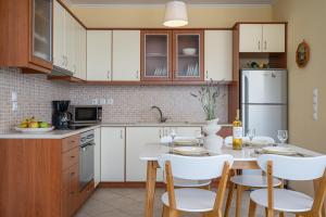Kuchyňa alebo kuchynka v ubytovaní Nostos - Psili Ammos Apartments