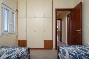Posteľ alebo postele v izbe v ubytovaní Nostos - Psili Ammos Apartments