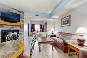 a living room with a couch and a fireplace at Chula Vista Condo 2344 and 2346 in Wisconsin Dells