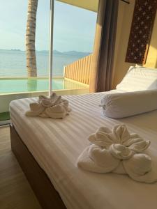 Ένα ή περισσότερα κρεβάτια σε δωμάτιο στο BangPo Resort