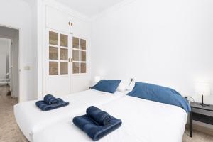 Postel nebo postele na pokoji v ubytování Home2Book Bright & Comfy Stay Pto del Rosario