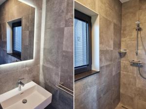 ein Badezimmer mit Waschbecken und Spiegel in der Unterkunft Luxurious detached water villa with jetty in Balk