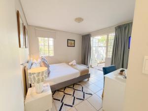 Amoris Guesthouse Randburg II - Darrenwood客房内的一张或多张床位