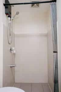 a bathroom with a shower with a shower curtain at NEW Cozy Studio Condo Prime Cebu IT Park Hotspot in Cebu City