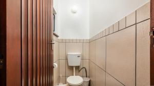 a bathroom with a white toilet in a room at 26 Marion Road in Ballito +28 photos