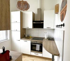 Kuchyňa alebo kuchynka v ubytovaní Brody Art Boutique Apartments