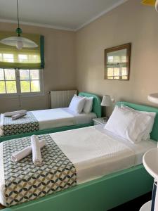 Posteľ alebo postele v izbe v ubytovaní Armonia House Potamos Village