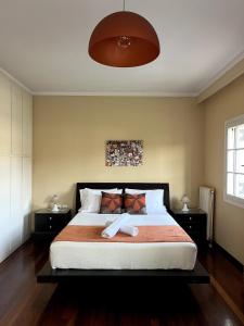 Posteľ alebo postele v izbe v ubytovaní Armonia House Potamos Village