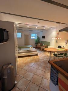 a living room with a couch and a table at Apartment Familie Scheibel in Bad Vilbel
