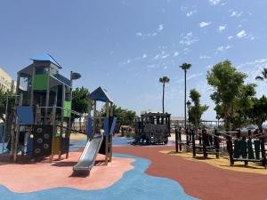 a playground at a park with a slide at 327 marina duquesa in Manilva