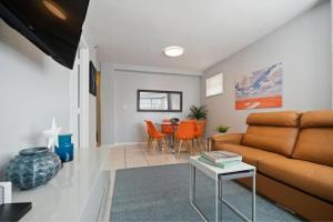 a living room with a couch and a table at South Beach Luxury, 2 Bedroom, Across from Beach in Miami Beach