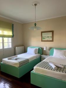 Posteľ alebo postele v izbe v ubytovaní Armonia House Potamos Village + 37 fotografií