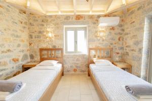 Ένα ή περισσότερα κρεβάτια σε δωμάτιο στο Villa Dioni Tria