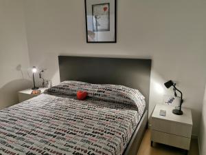 a bedroom with a bed with a red heart on it at Cuore Rosso in Chiavari