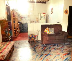 a living room with a couch and a rug at Casa da Pri em São Jorge in Sao Jorge +16 photos