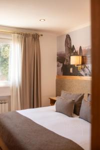 Postel nebo postele na pokoji v ubytování Hotel Tres Reyes