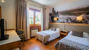 Postel nebo postele na pokoji v ubytování Hotel Tres Reyes