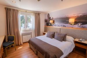 Postel nebo postele na pokoji v ubytování Hotel Tres Reyes