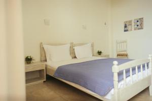 Postel nebo postele na pokoji v ubytování Faros Hotel