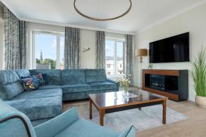 Χώρος καθιστικού στο Luxury Apartment with Three Bedrooms Air Conditioning and Parking by Noclegi Renters +26 φωτογραφίες