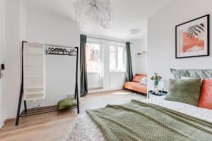a white bedroom with a bed and a window at Suite Joka Part Dieu Wifi Check in H24 in Fourvière
