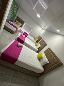a bedroom with a large bed in a room at Hotel Millenium Victoria Plaza in Cúcuta +23 photos