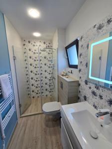 a bathroom with a shower and a toilet and a sink at Къща Холидей Обзор in Obzor +34 photos